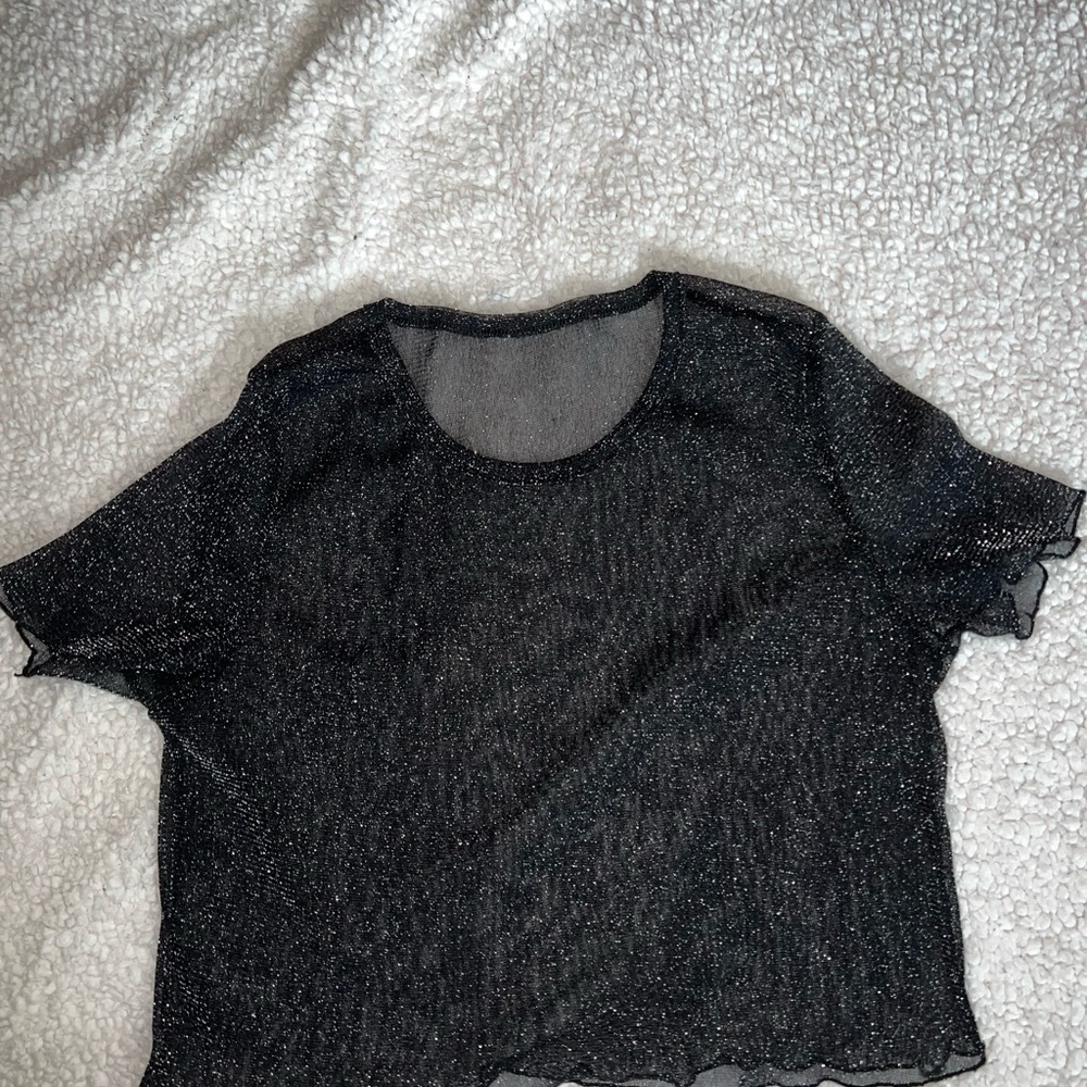 sparkly see-through top. is super cute under a tank top!! wore it for new years!